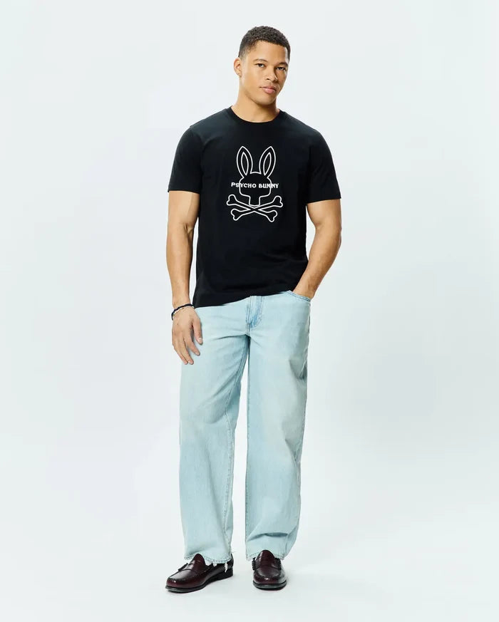 Mens Craig Graphic Tee, a classic fit black cotton jersey t-shirt featuring a large white outline Psycho Bunny skull and crossbones graphic logo centered on the chest.