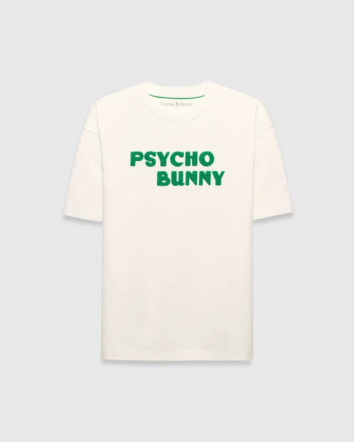 Mens Craig Wordmark Tee, a cream relaxed fit jersey t-shirt featuring a prominent green textured PSYCHO BUNNY wordmark graphic on the chest and a small green logo on the inner neck.