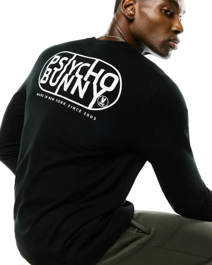 Black Mens Dariel Long Sleeve Back Graphic Tee in soft jersey knit, featuring a large white Psycho Bunny oval graphic on the back with Made In New York Since 2005 text and the iconic bunny skull logo.