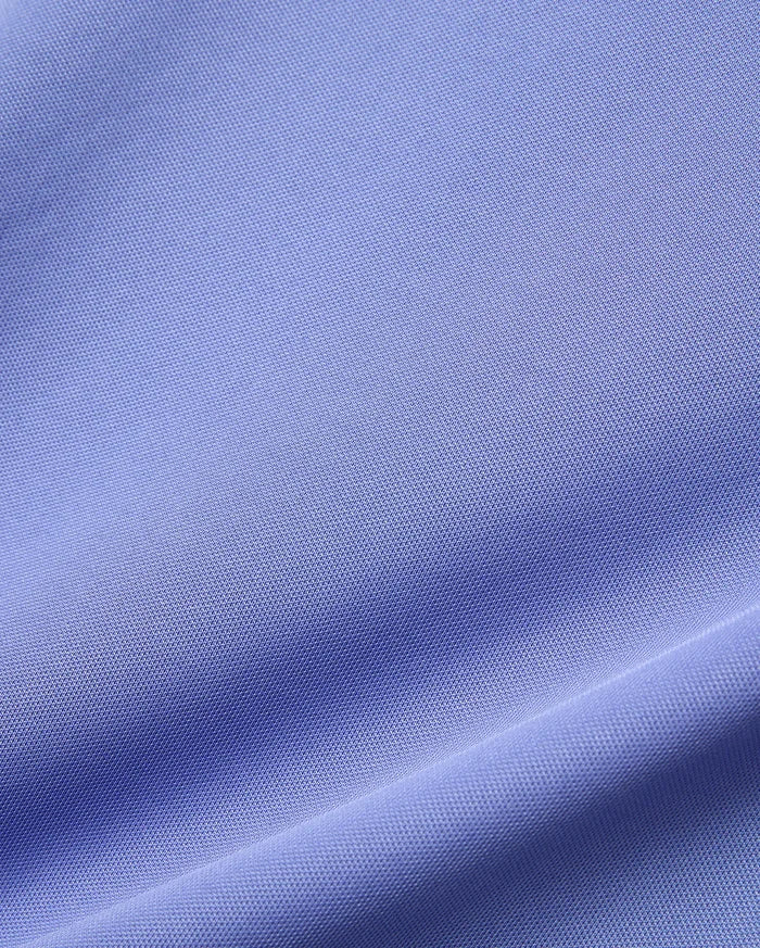 Mens Dash Bunny Sport Tee crafted from a premium, light lavender, finely textured pique knit performance fabric, highlighting its subtle weave, soft feel, and elegant drape.