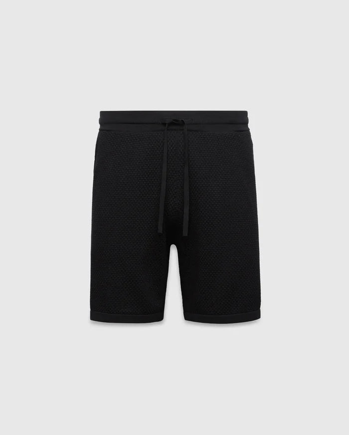 Black MENS DEVON KNIT SHORT with a relaxed fit, featuring a textured knit fabric, ribbed waistband, and drawstring closure. No visible Psycho Bunny logo.