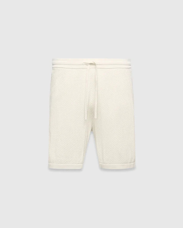 Mens Devon Knit Short in cream, a relaxed fit short crafted from a distinctive textured waffle knit fabric, featuring a ribbed waistband and an adjustable drawstring.