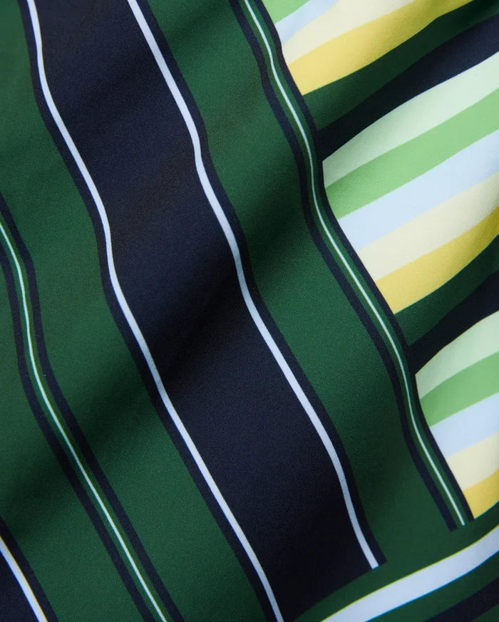 Mens Drew All Over Print Swim Trunk featuring a bold multi-directional stripe pattern in dark green, navy, white, light green, yellow, and light blue on smooth fabric.