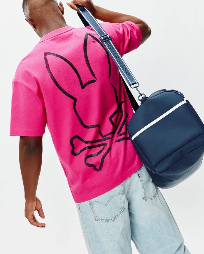 Mens Duncan Wordmark Relaxed Fit Tee in vibrant fuchsia jersey, featuring a large, distressed black Psycho Bunny skull and crossbones graphic prominently on the back.