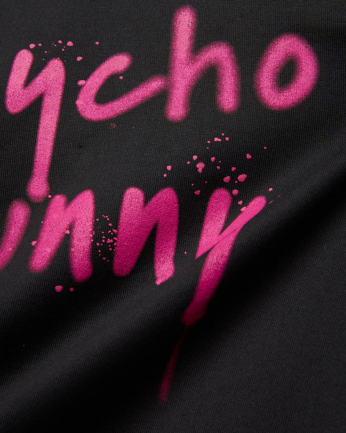 Mens Duncan Wordmark Relaxed Fit Tee, black with a vibrant pink spray paint style Psycho Bunny wordmark graphic featuring paint splatters and a soft jersey texture.