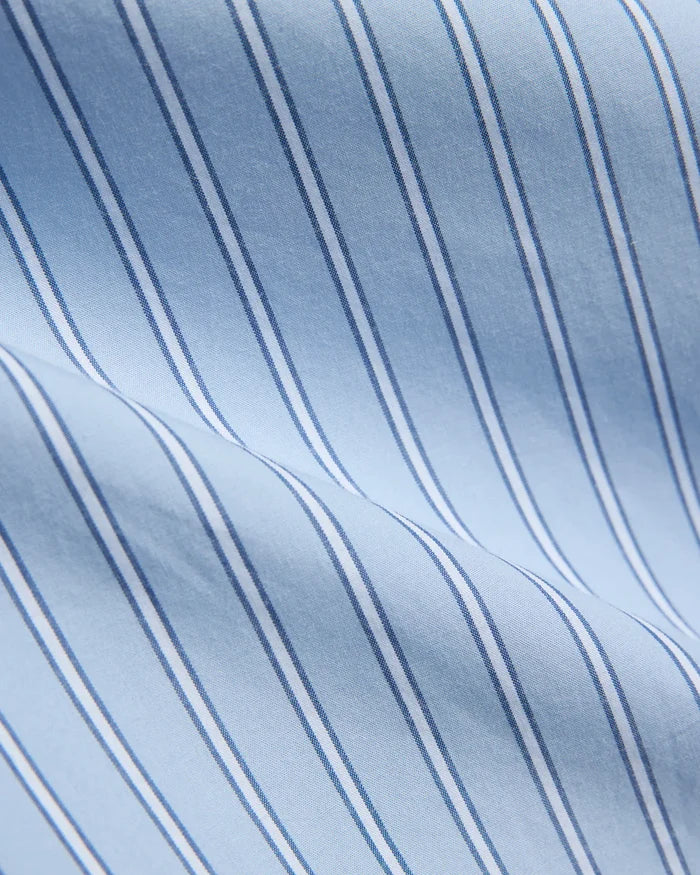 Mens Duncan Stripe Shirt, a premium light blue fine woven fabric shirt, featuring crisp white vertical stripes bordered by thin navy blue pinstripes, creating a sophisticated, bold pattern.