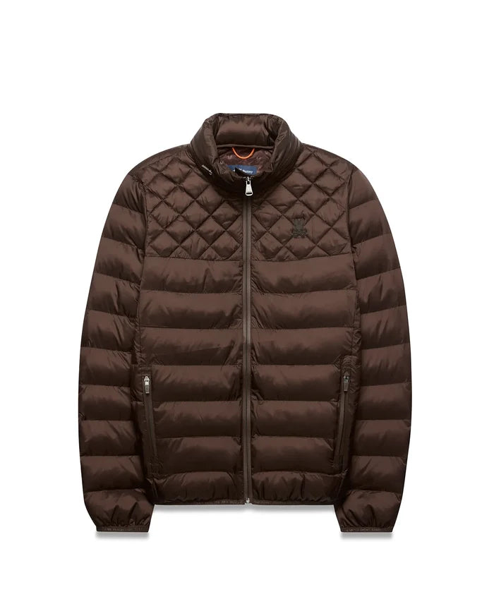 Mens Emerik Puffer Jacket, brown, with diamond quilted shoulders, horizontal body quilting, full zip, stand collar, and small embroidered Psycho Bunny skull logo on left chest; orange inner collar.