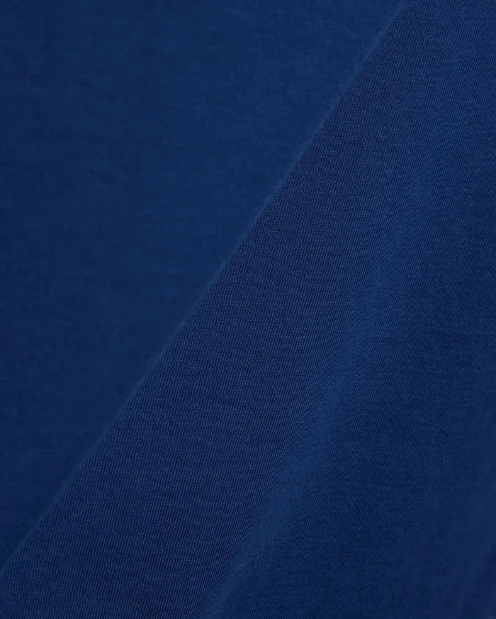 Mens Emmanuel Graphic Tee in rich navy blue, showcasing a soft, smooth jersey fabric on the main body, complemented by a finely textured, diagonal ribbed knit detail.