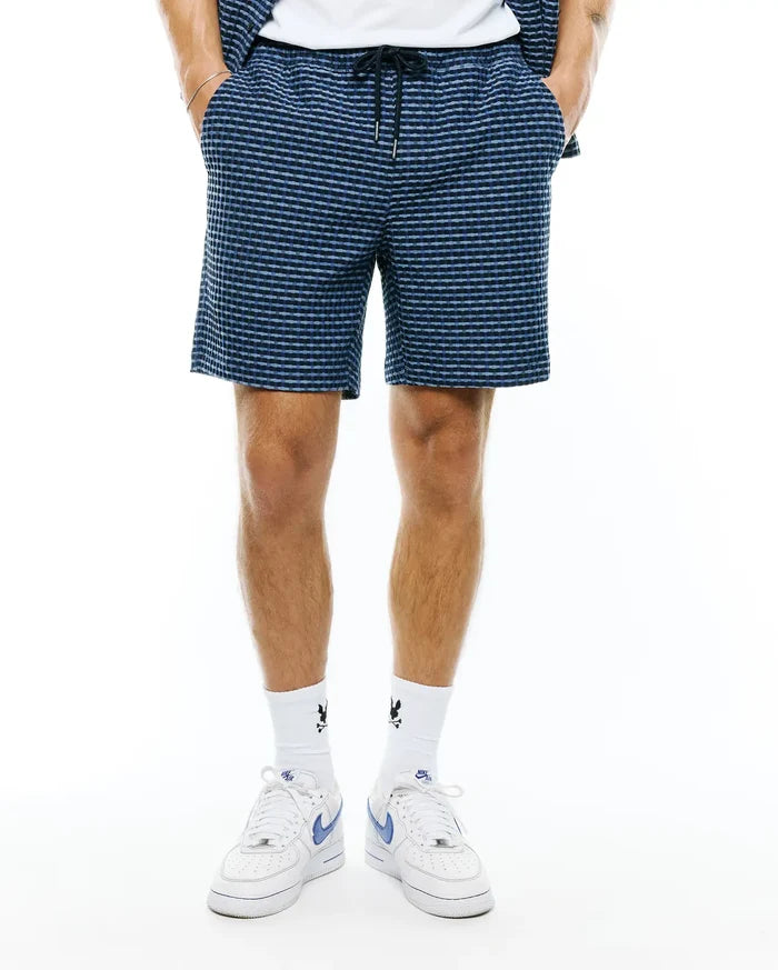 Mens Erik Raised Check Short, a relaxed fit short in dark blue with a lighter blue raised check pattern, featuring a comfortable drawstring waist and side pockets.