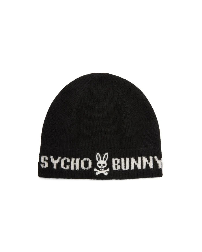 Black knitted Mens Eugene Wordmark Beanie with a ribbed cuff, featuring a large white Psycho Bunny wordmark and iconic bunny skull logo prominently displayed on the front.