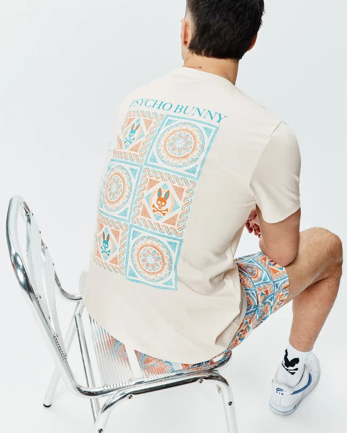 Cream Mens Frank Back Graphic Tee, classic fit jersey, with a large teal and orange geometric and Psycho Bunny skull back graphic, paired with matching relaxed fit woven shorts.