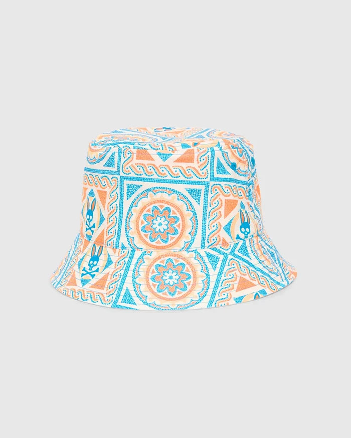 Mens Frank Reversible Bucket Hat, a premium streetwear accessory, featuring a white base with intricate turquoise and orange mosaic-style geometric and floral patterns, prominently displaying the iconic Psycho Bunny skull logo throughout.