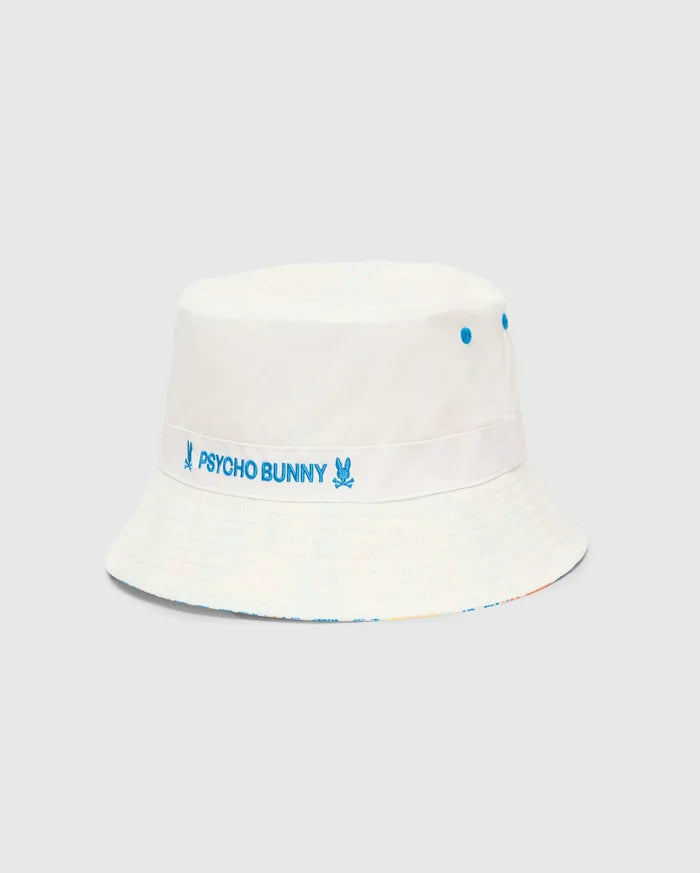 Mens Frank Reversible Bucket Hat in white, featuring a prominent blue embroidered Psycho Bunny text and skull logo band, blue ventilation eyelets, and a subtle multicolor pattern on the reversible side.