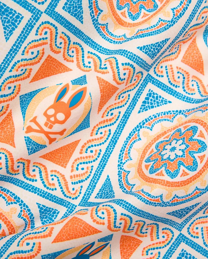 Mens Frank Swim Trunk 6 with an off-white base, featuring a vibrant blue, orange, and peach mosaic-style all-over print, including the iconic Psycho Bunny skull logo.