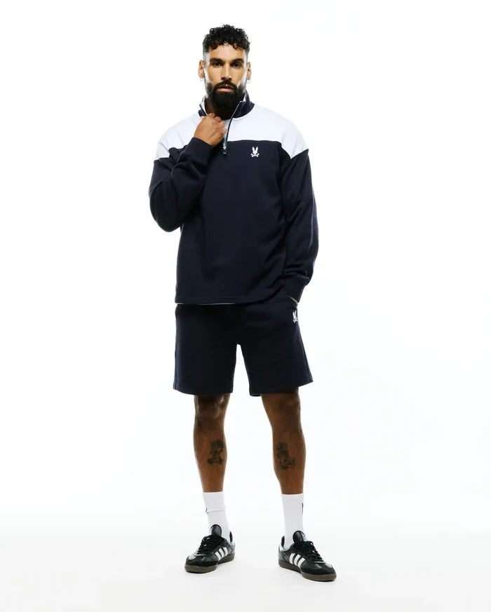 Navy French terry quarter-zip sweatshirt with white color block and embroidered Psycho Bunny skull logo, paired with matching Mens Gabe French Terry Sweatshort featuring an embroidered bunny skull.
