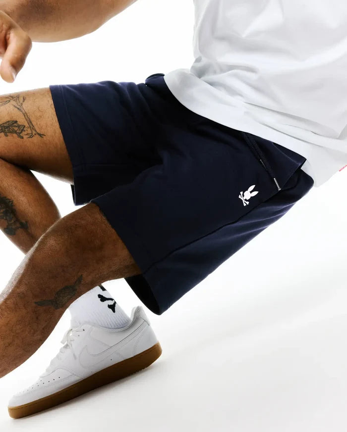 Navy Mens Gabe French Terry Sweatshort with a relaxed fit, featuring a white embroidered Psycho Bunny skull logo on the left thigh and a functional drawstring waist.
