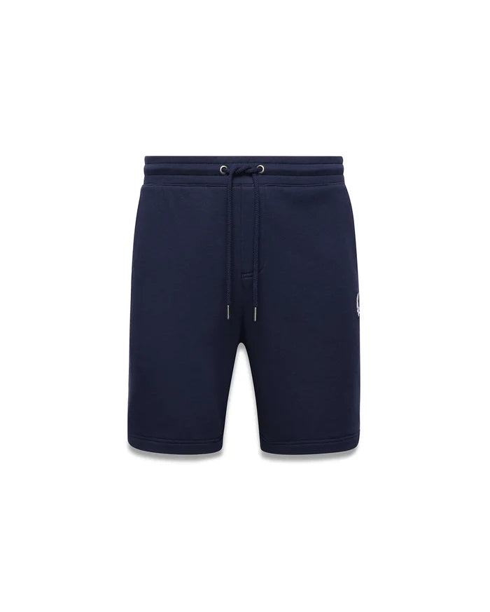 Mens Gabe French Terry Sweatshort in navy blue, featuring a relaxed fit, drawstring waist, and a small white embroidered Psycho Bunny skull logo on the lower left leg.