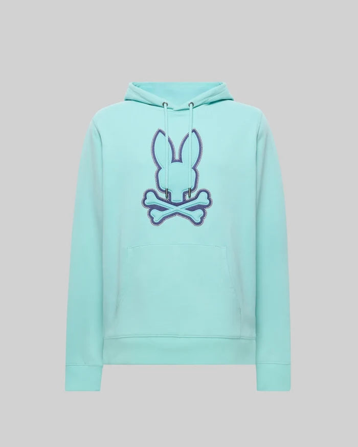 Mens Gage Patch Hoodie, a classic fit aqua hoodie featuring a large central embroidered Psycho Bunny skull logo with a deep blue zigzag stitch outline, a drawstring hood, and a front kangaroo pocket.