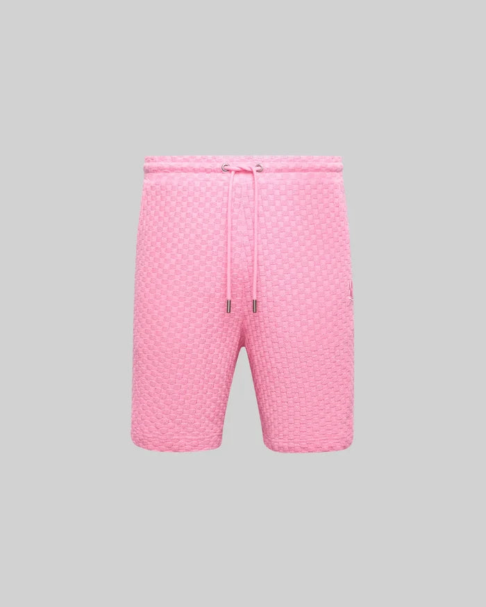Mens Garen Knit Short in vibrant pink, featuring a unique woven checkerboard texture, relaxed fit, drawstring waist with silver tips, and a small embroidered Psycho Bunny skull logo on the right thigh.