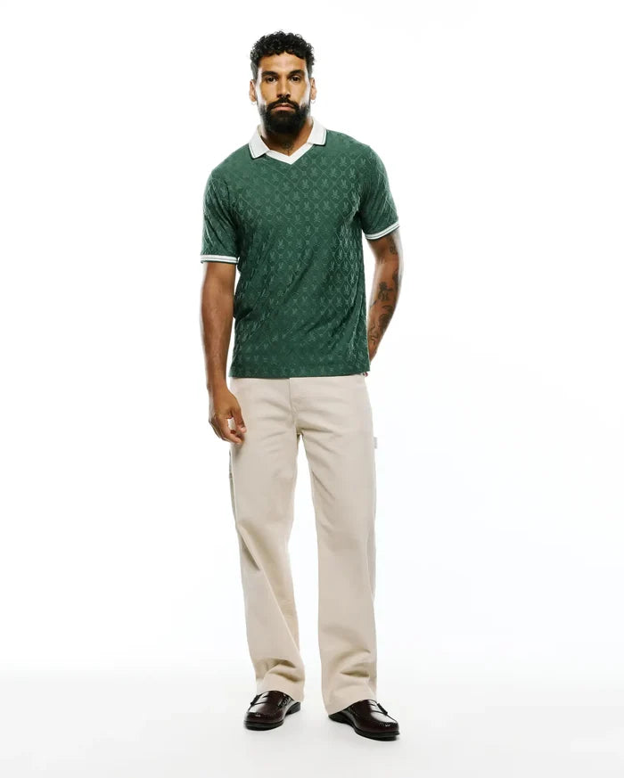 Mens Garry Jacquard Johnny Collar Polo in dark green, featuring an all-over bunny skull jacquard pattern, a white Johnny collar, and white striped cuffs, in a classic fit textured knit.