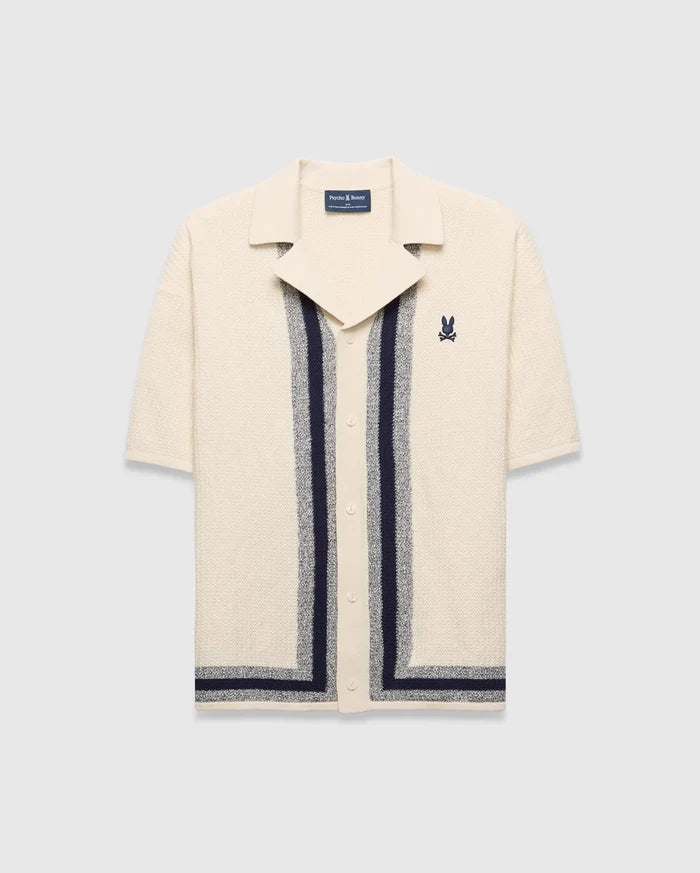 Mens Giles Relaxed Fit Border Knit Shirt in cream textured knit with navy and heathered grey vertical stripes, a spread collar, and an embroidered Psycho Bunny skull logo on the left chest.