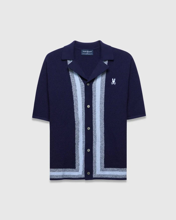 Mens Giles Relaxed Fit Border Knit Shirt in navy, featuring a textured knit, light blue and grey vertical stripes, a matching hem stripe, open collar, and a small embroidered white Psycho Bunny skull logo on the left chest.