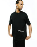 Mens Haiden Relaxed Heavy Weight Tee, a premium black heavyweight jersey crew neck t-shirt with short sleeves, featuring a prominent white PSYCHO BUNNY® text logo on the lower left front, embodying refined streetwear.