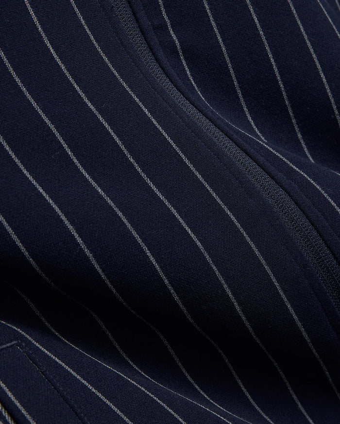 Mens Harland Double Weave Chalk Stripe Track Jacket in navy, featuring subtle white pinstripes and a textured zipper, highlighting its premium double weave fabric.