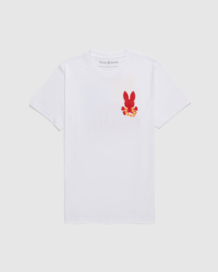 A white MENS HAWAII CITY TEE - B6U169Y1PC with short sleeves featuring a small red graphic of a bunny on the left chest area. The graphic includes yellow and orange floral details. Made from soft Pima cotton jersey, the label inside the collar reads "Psycho Bunny." The shirt is displayed against a plain white background.