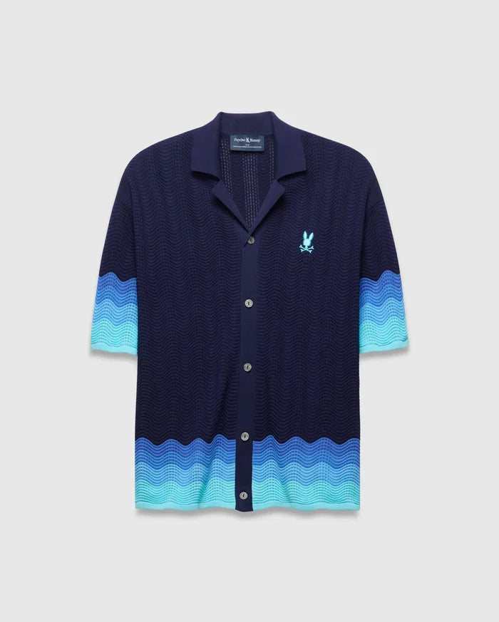 Mens Holden Oversized Knit Shirt: Navy blue wavy knit with camp collar, button-front, and light blue to turquoise wavy color block hem and sleeve cuffs. Embroidered light blue Psycho Bunny skull logo on left chest.