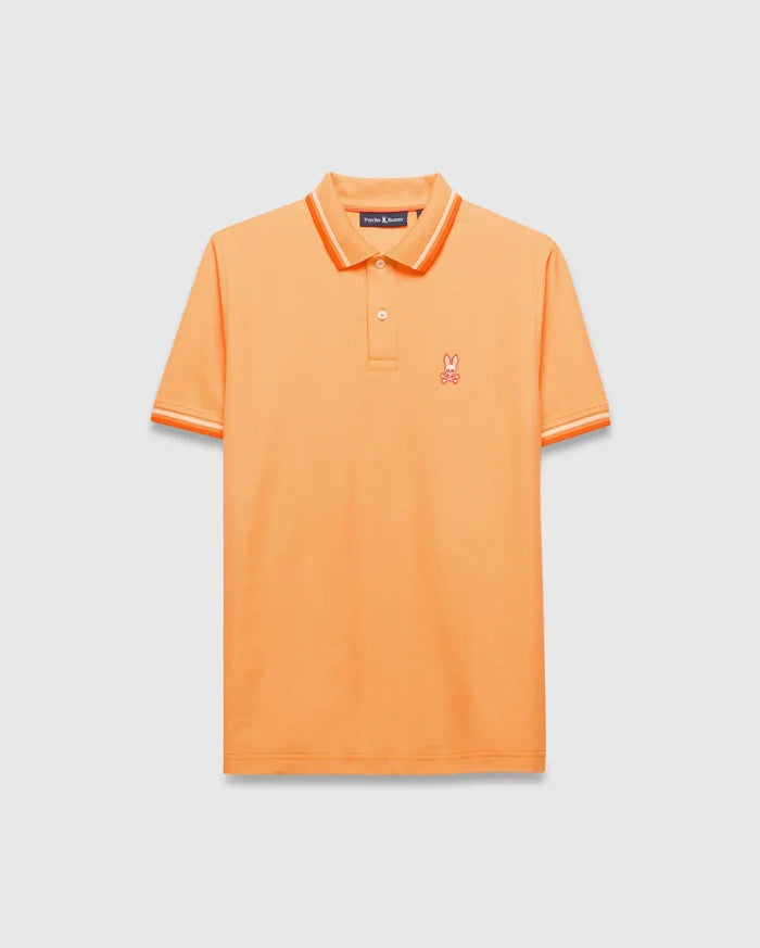 Mens Holden Pique Polo, vibrant orange classic fit pique knit with orange and white tipped collar and cuffs, featuring a small embroidered orange Psycho Bunny skull logo on the left chest.