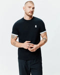 Mens Holden Tee, a classic fit black jersey t-shirt featuring white striped sleeve cuffs and a small embroidered Psycho Bunny skull logo on the left chest.