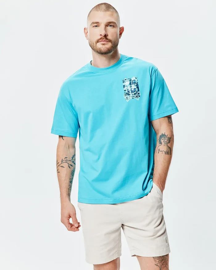 Mens Isaac Relaxed Fit Tee in vibrant aqua blue, a relaxed fit jersey t-shirt with a small, distressed blue and white Psycho Bunny skull graphic print on the left chest.