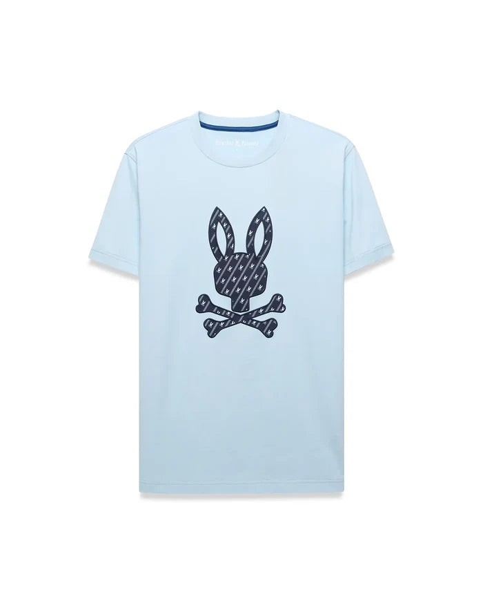 Mens Jaden Graphic Tee, a light blue classic fit jersey t-shirt featuring a large central dark blue Psycho Bunny skull logo graphic filled with a repeating mini-logo pattern, with subtle inner collar branding.