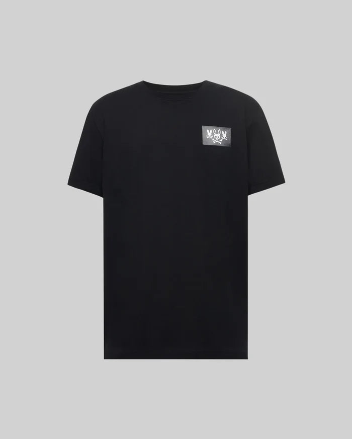 Mens Jarvis Chest Graphic Tee. Black classic fit jersey t-shirt with a small white Psycho Bunny skull and multiple bunny skulls graphic print on the left chest.