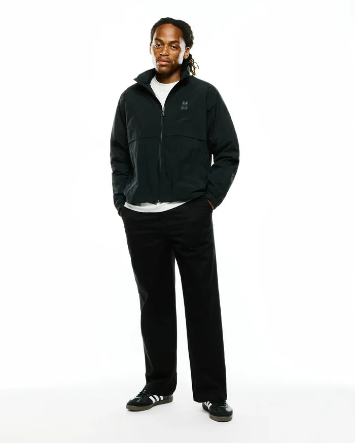 Mens Javier Nylon Windbreaker Jacket, dark green, relaxed fit, smooth nylon, full zip, stand collar, small tonal embroidered Psycho Bunny skull logo on left chest, elastic cuffs and hem.
