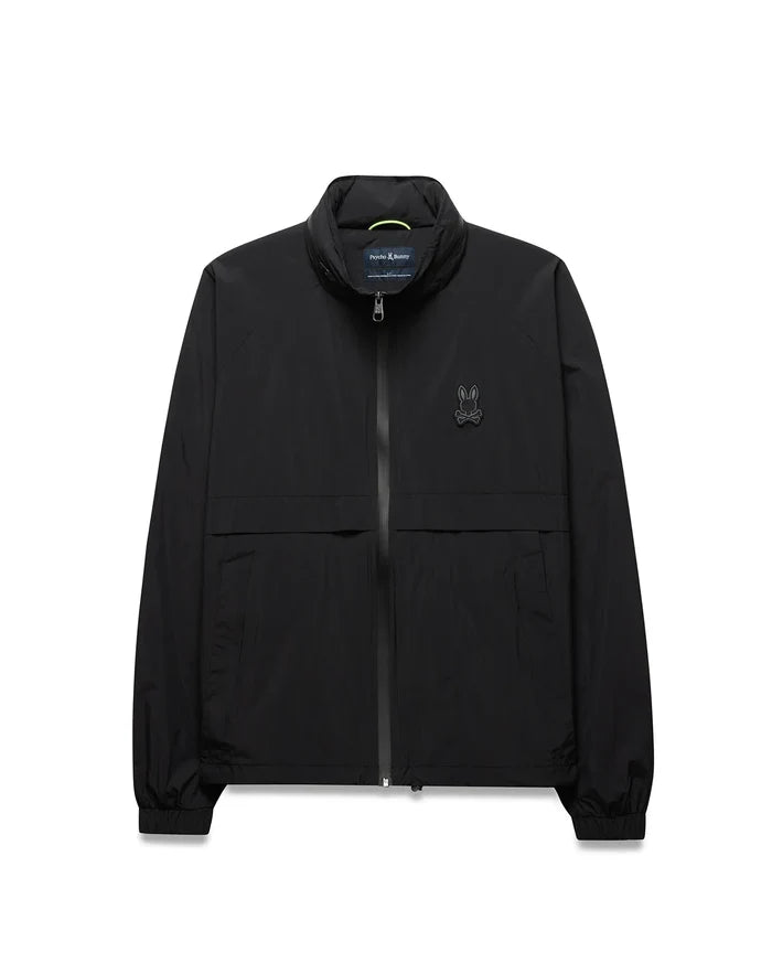 Black Mens Javier Windbreaker Jacket with a classic fit, smooth fabric, full zip, stand collar with neon green accent, elastic cuffs and hem, and a small dark grey embroidered Psycho Bunny skull logo on the left chest.