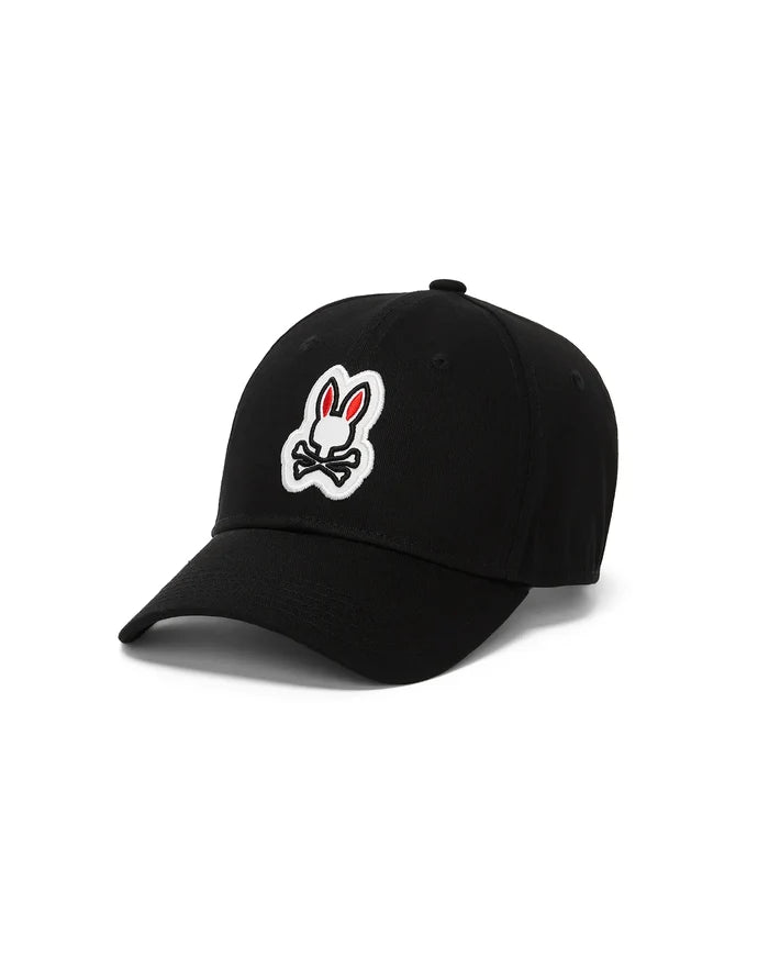 Mens Jaydon Baseball Cap, a black classic twill cap featuring the iconic, prominently embroidered white and red Psycho Bunny skull logo centered on the front panel.