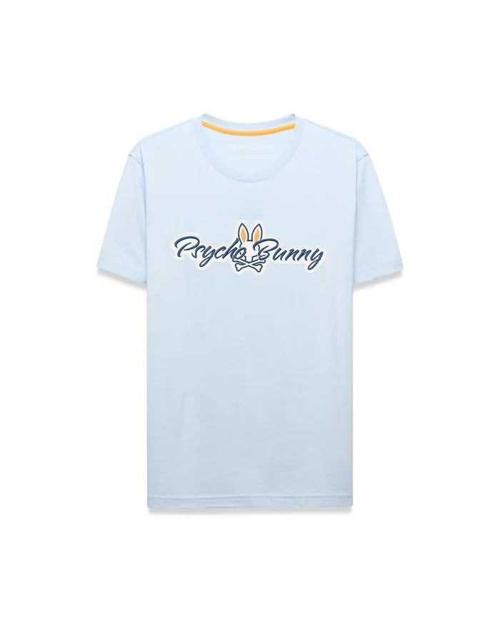 Mens Jaydon Wordmark Graphic Tee, a light blue classic fit jersey t-shirt featuring a large central Psycho Bunny wordmark logo in white with navy outline and orange bunny skull, plus orange neck tape.
