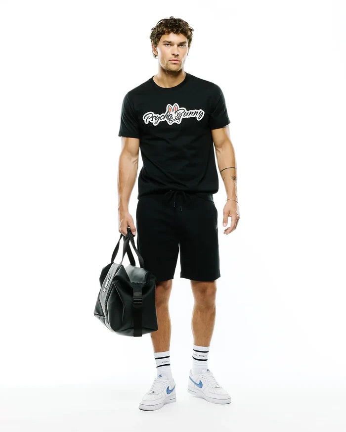 Black MENS JAYDON WORDMARK GRAPHIC TEE in a classic fit, crafted from soft jersey fabric, featuring a large white Psycho Bunny wordmark logo with red ears and blue eyes centered on the chest.