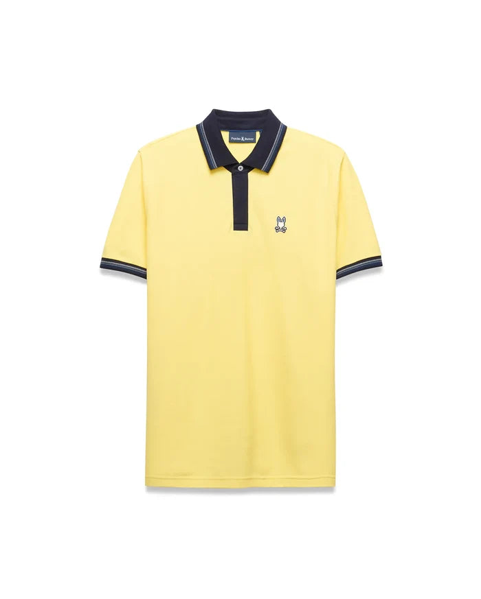 Mens Jaydon Pique Polo in bright yellow, featuring a navy blue collar with white tipping, a two-button placket, ribbed cuffs with matching stripes, and a small embroidered Psycho Bunny logo on the left chest for a classic fit.