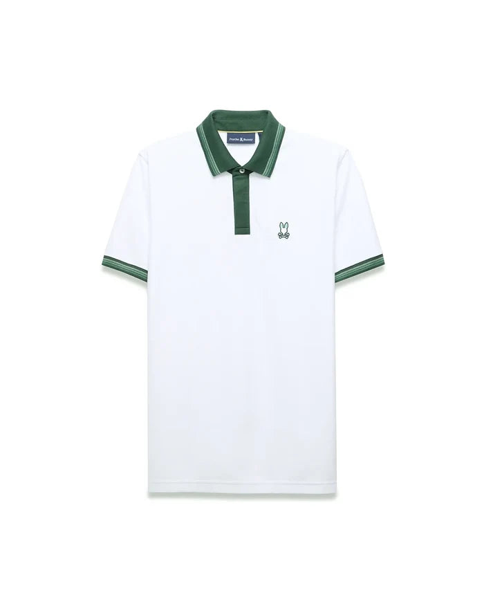 Mens Jaydon Pique Polo in white pique, featuring a dark green collar and placket. It has striped green cuffs and a small, embroidered green Psycho Bunny skull logo on the left chest, offering a classic fit.