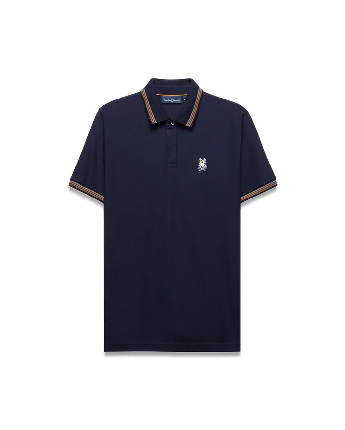Mens Jaydon Pique Polo, classic fit navy pique polo shirt with ribbed collar and cuffs featuring orange and brown stripes, and a small embroidered white and blue Psycho Bunny skull logo on the left chest.