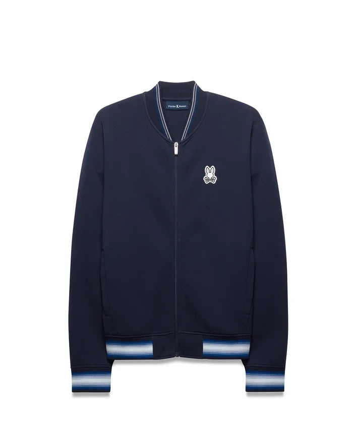 Mens Jaydon Track Jacket in navy, featuring a classic fit, smooth jersey fabric, embroidered white Psycho Bunny skull logo on the left chest, and striped ribbed collar, cuffs, and hem in white and blue.