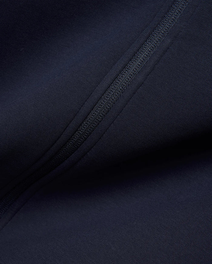 Mens Jaydon Track Jacket in deep navy, crafted from a smooth, performance-ready knit fabric, featuring a sleek, tonal full-zip closure for a refined streetwear look.