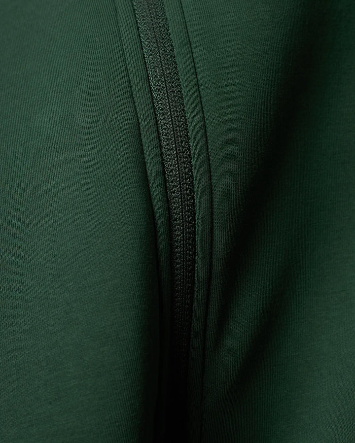 Mens Jaydon Track Jacket in a rich, deep forest green, featuring a prominent tonal zipper closure and a finely textured ribbed knit fabric.