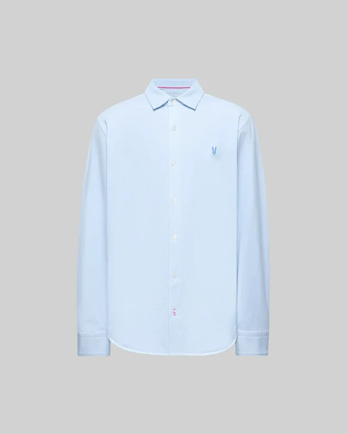 The Psycho Bunny MENS JIM JERSEY STRIPED KNIT SHIRT (MT0300041) is a light blue, long-sleeve pima cotton shirt with a collar and small embroidered blue logo on the left chest, shown against a plain gray background.