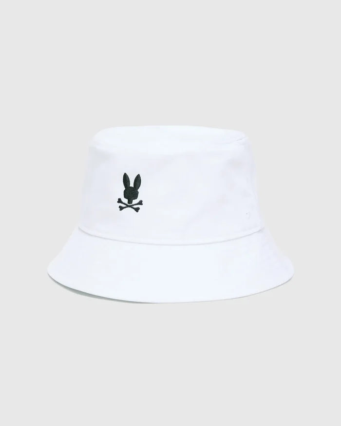 Mens Jimmy Bucket Hat in crisp white cotton twill, featuring a prominent black embroidered Psycho Bunny skull logo centered on the front, with subtle ventilation eyelets.