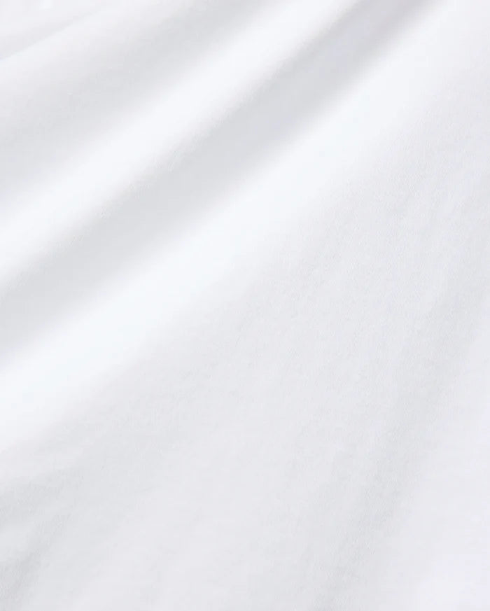 Crisp white Mens John Back Graphic Tee crafted from premium, smooth jersey knit fabric, featuring subtle fabric folds and a refined, clean aesthetic, embodying Psycho Bunny's signature streetwear style.