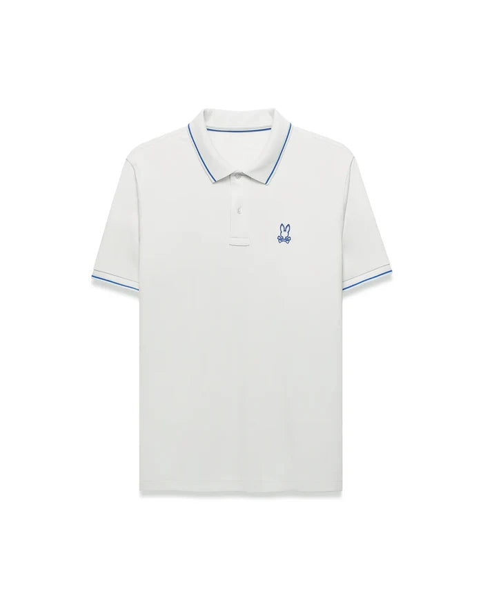 Men's Joji Performance Polo, a classic fit white performance jersey polo with blue tipped collar and cuffs, featuring a small embroidered blue Psycho Bunny skull logo on the left chest.